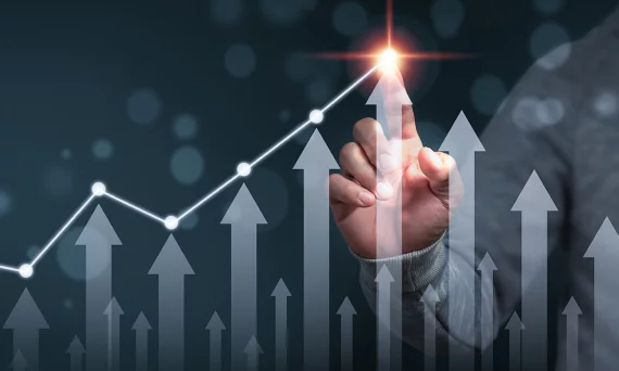 A businessman shows an arrow graph that depicts the company's future growth strategy and percentage increase. The idea is to start a business from the ground up in order to succeed and grow.